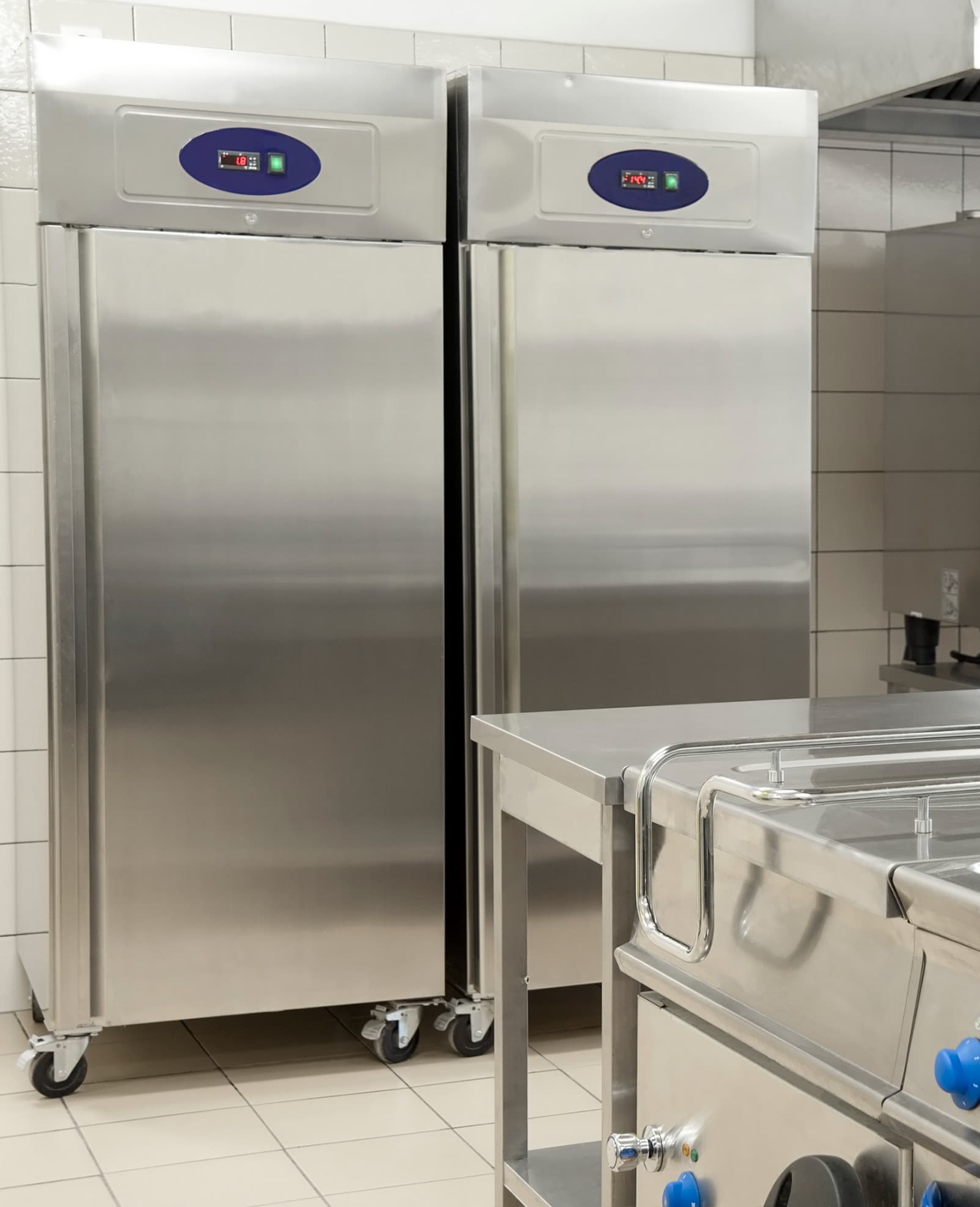 Commercial upright fridges in a professional kitchen